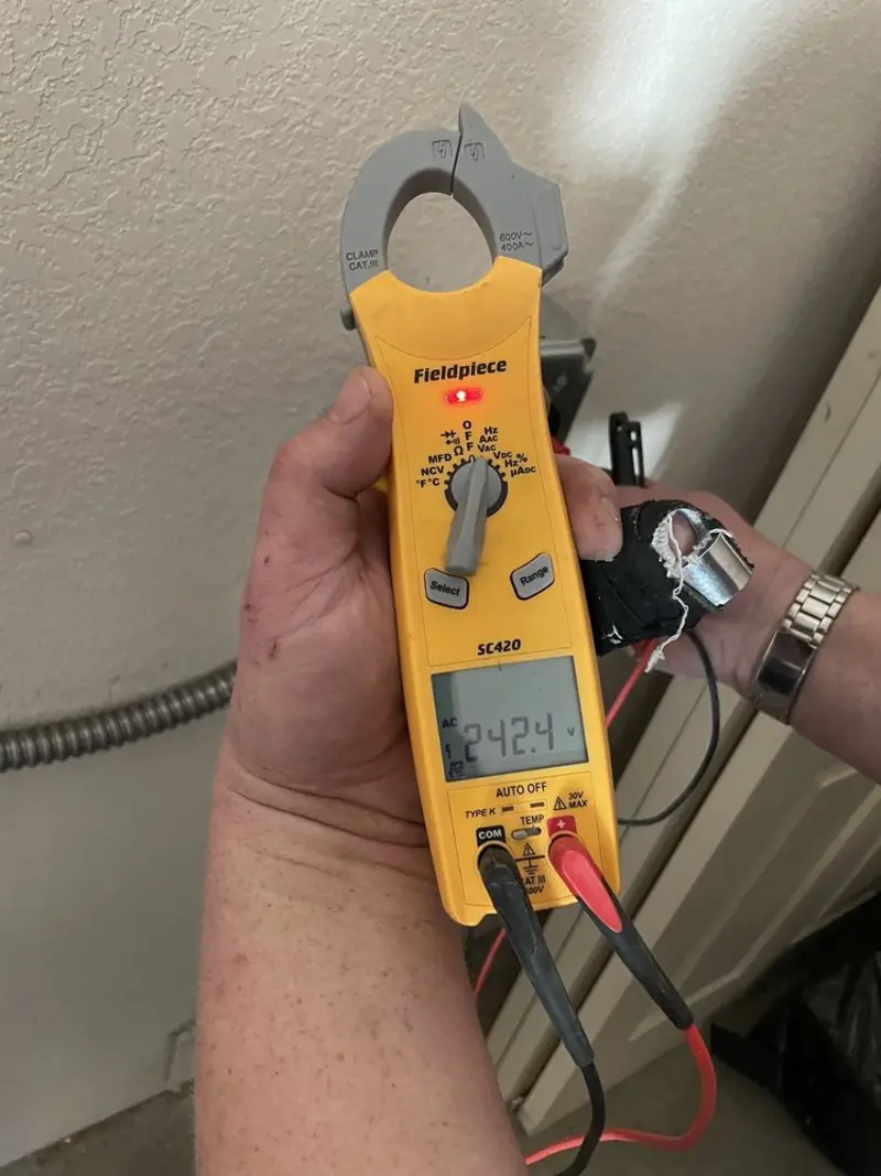 Voltage testing with clamp meter during Generator Installation in Kasson